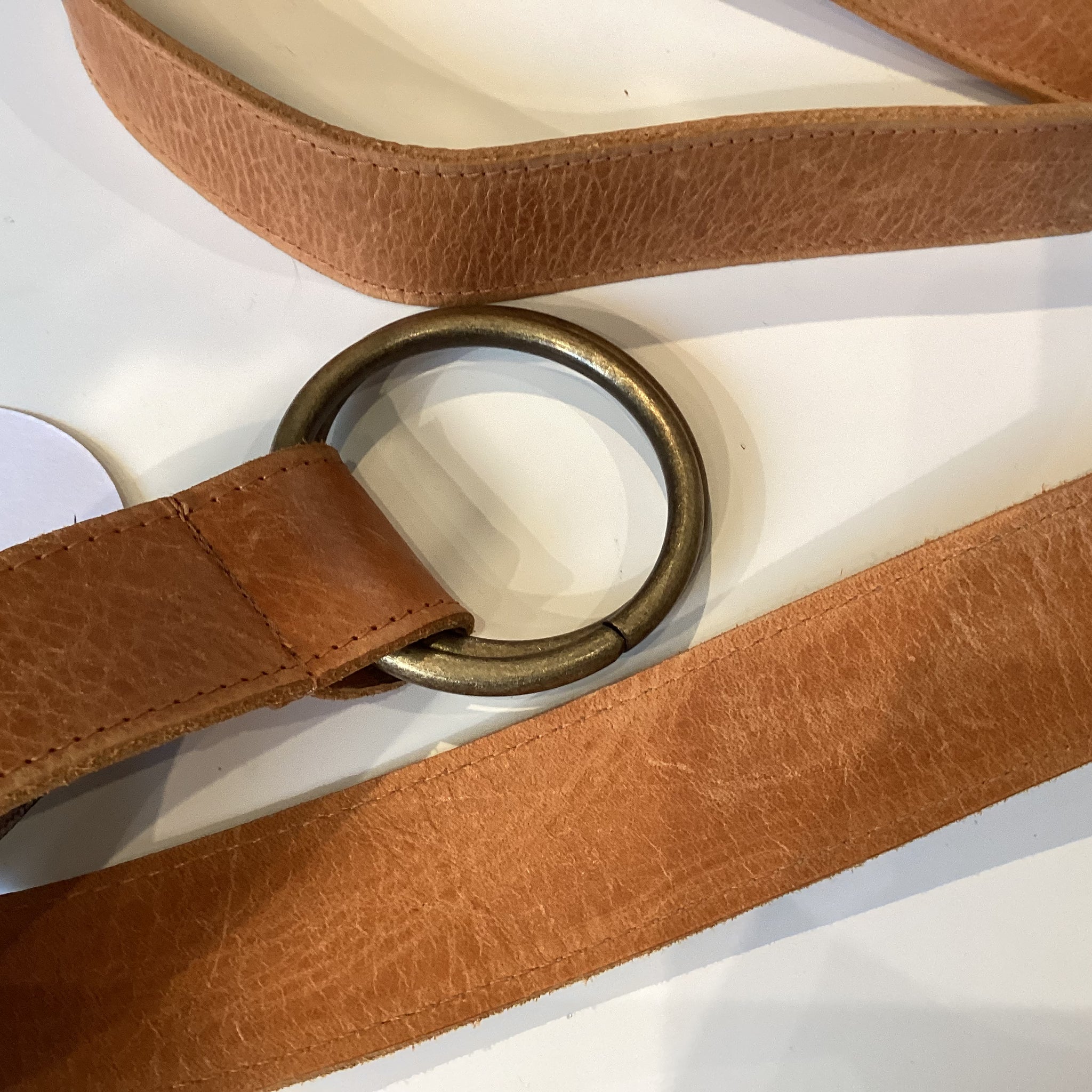 Leather belt with brass buckle